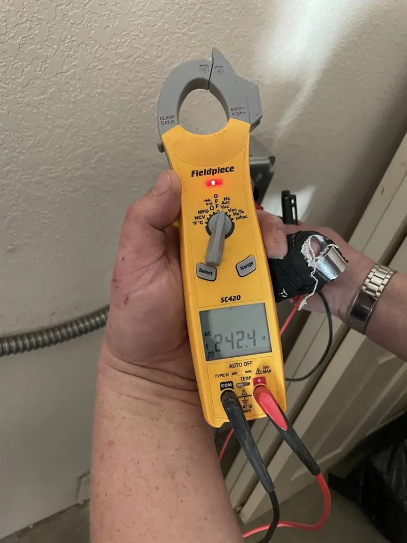 Voltage testing with clamp meter during Electrical Installation Services in Mattawa